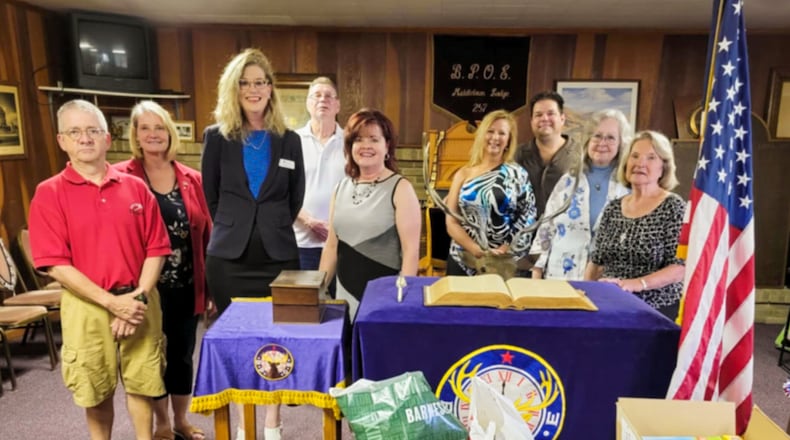 In 2021, the Middletown Elks Lodge #257 purchased books and board games for the Blue Star Families chapter that serves Southwest Ohio. The books and board games are given to local military families. Pictured left to right are Bret Frank, Karen Frank, Geri Maples, PhD/Chapter Director of Blue Star Families, John Ramsey, Melodie Rickard, Angie Whitt Sberna, Jim Sberna, Linda Jordan and Connie Back. Contributed.