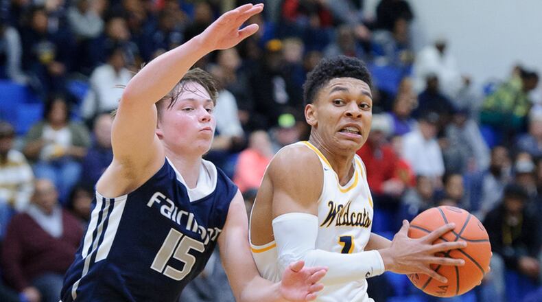 Springfield senior guard Michael McKay dribbles with pressure from Fairmont’s Jack Hendricks during a GWOC National East game on Friday night. Contributed Photo by Bryant Billing