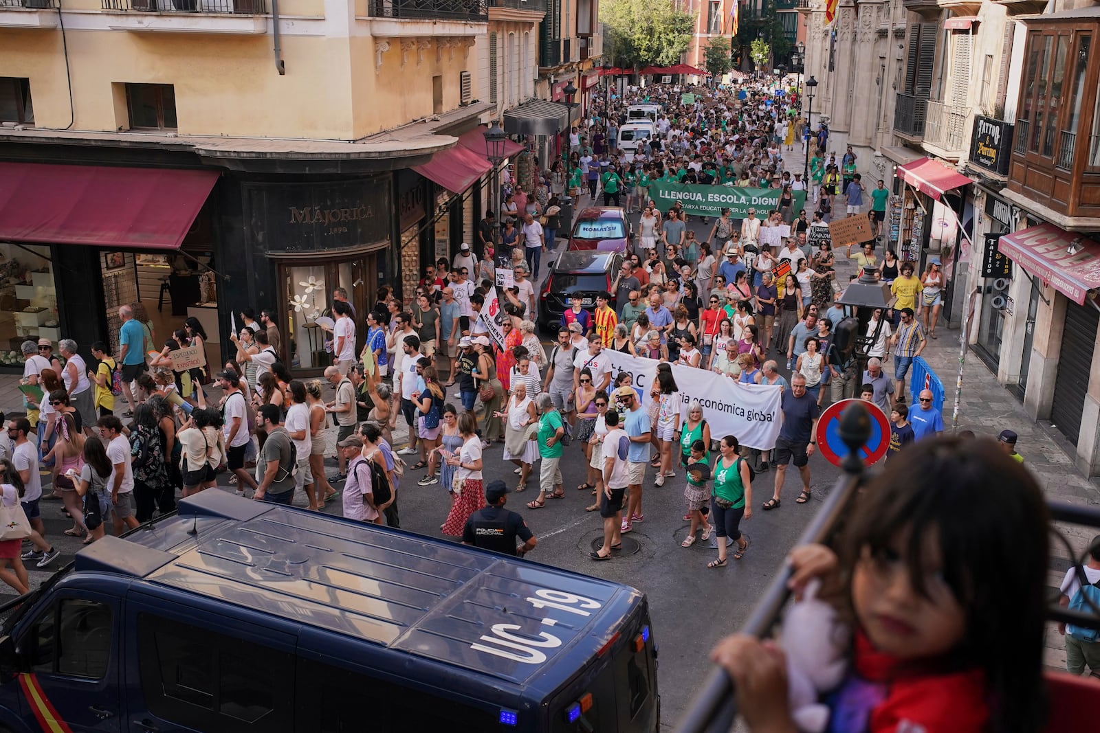 People march during a protest against overtourism in the Balearic island of Mallorca, Spain, Sunday, June 15, 2025. (AP Photo/Joan Mateu Parra)