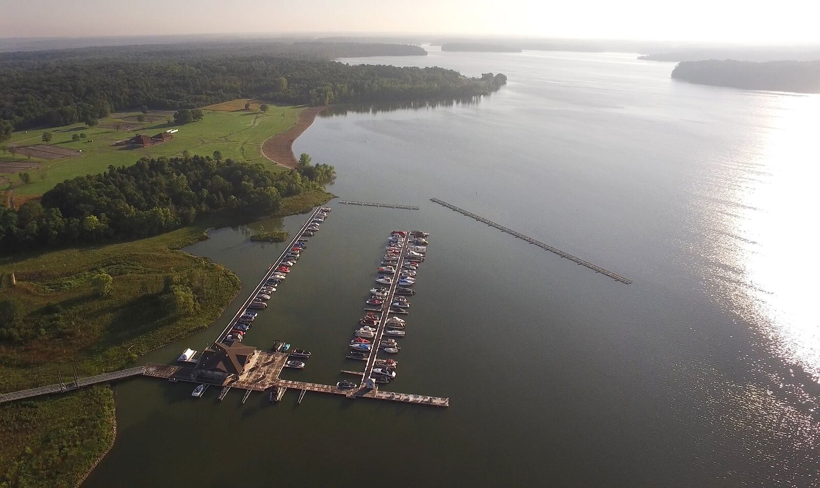The Caesar Creek Marina which was opened in April of 2016 is almost full of boats as seen in this early morning aerial photo made in August.  Years of planning and $8.8 million have created a busy marina that features more than 100 slips, concessions, fuel and restrooms for boaters.      TY GREENLEES / STAFF