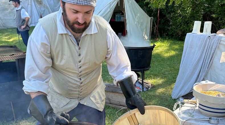 Derick Smith attends to a batch of kettle corn, one of the new foods offered at the 43rd annual Fair at New Boston over Labor Day weekend. CONTRIBUTED