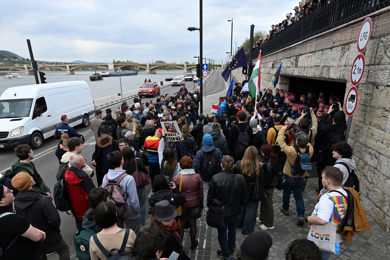 Supporters of the political party Momentum stage a protest in Budapest, Monday, April 14, 2025 after Hungary’s parliament has passed an amendment to the constitution that allows the government to ban public events by LGBTQ+ communities. (Tibor Illyes/MTI via AP)