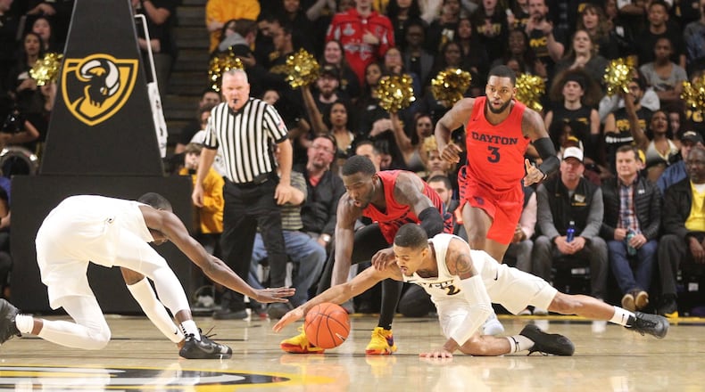 Dayton’s Jalen Crutcher chases a loose ball against Virginia Commonwealth on Wednesday, Jan. 19, 2019, at the Siegel Center in Richmond, Va. David Jablonski/Staff