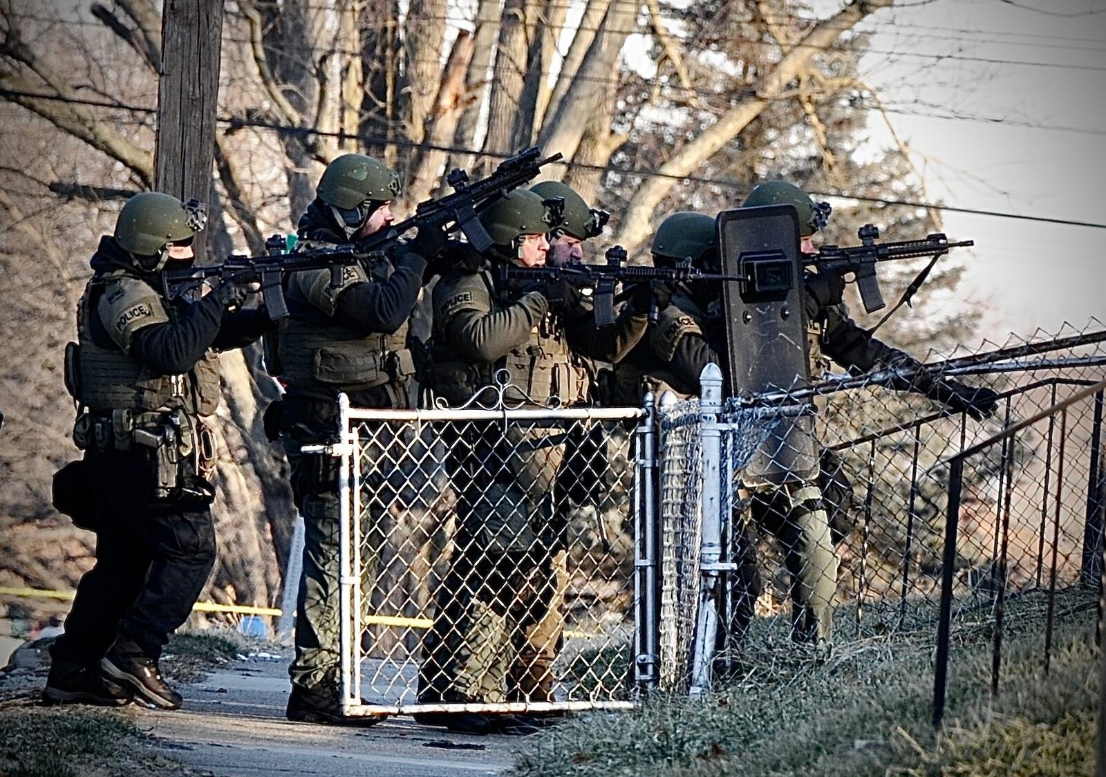 SWAT officers were preparing to enter a house on Anna Street in Dayton on Wednesday morning Jan. 26, 2022. Teens in the house were arrested. MARSHALL GORBY / STAFF