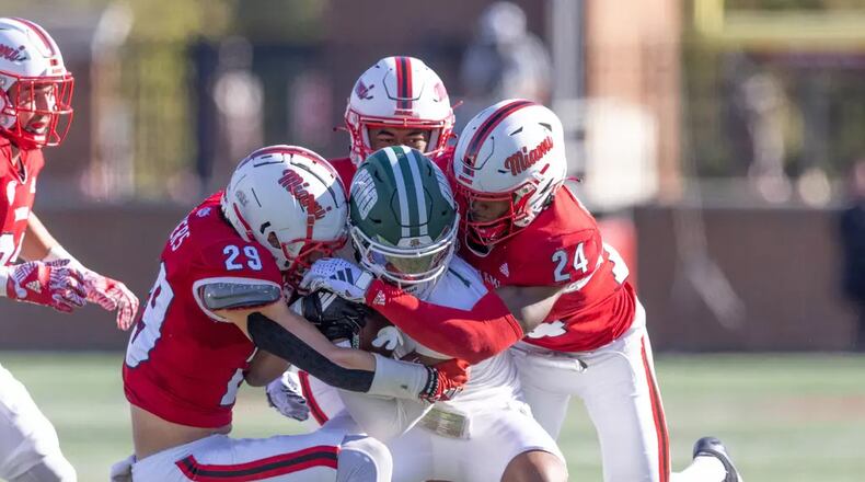 Miami's Silas Walters (29) and Mychal Yharbrough (24) make a tackle against Ohio last Saturday at Yager Stadium. Miami Athletics photo