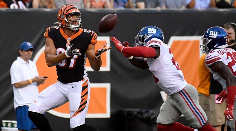 CINCINNATI, OH - AUGUST 22: C.J. Uzomah #87 of the Cincinnati Bengals catches a touchdown pass in the first quarter of the preseason game against the New York Giants at Paul Brown Stadium on August 22, 2019 in Cincinnati, Ohio. (Photo by Bobby Ellis/Getty Images)