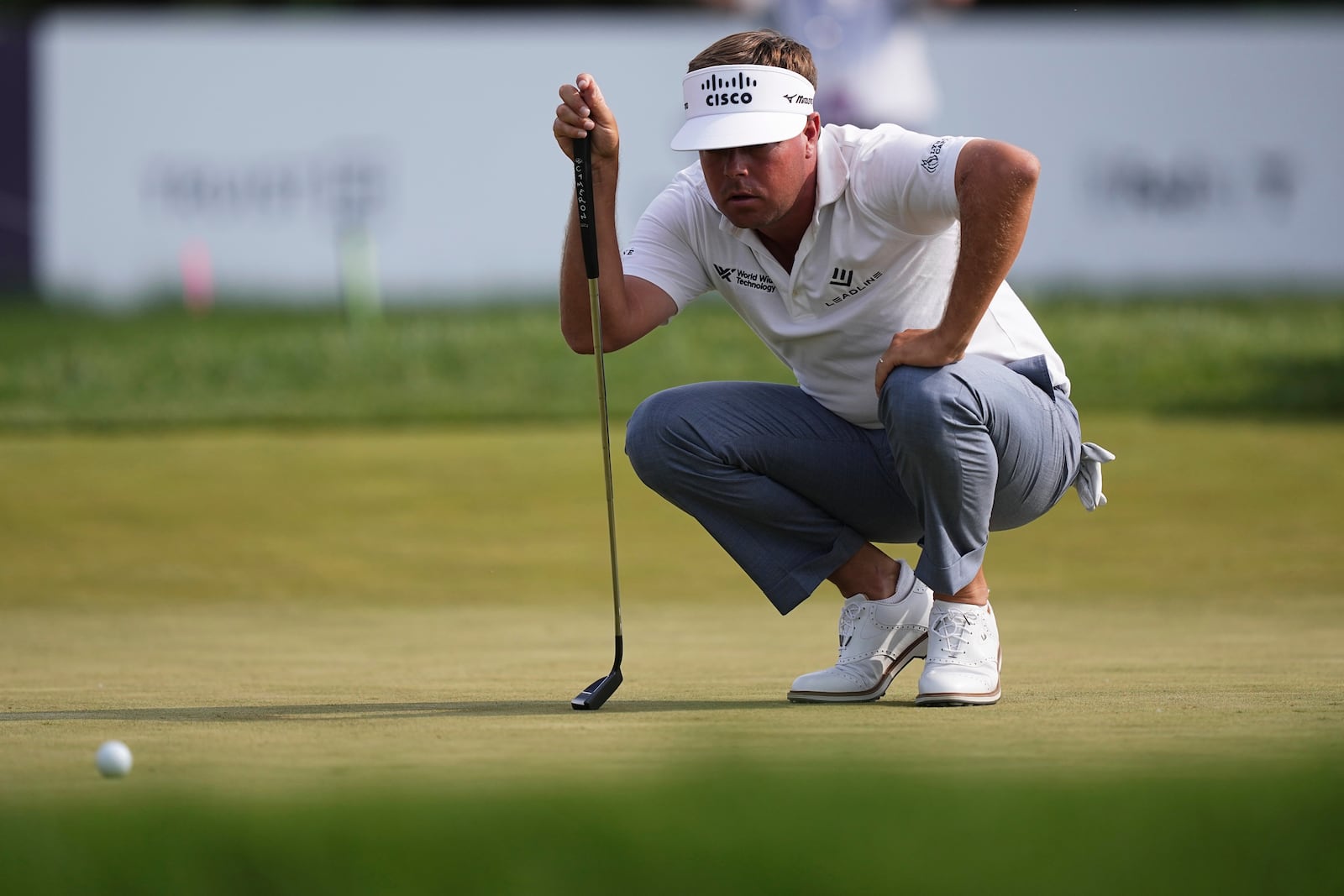 Keith Mitchell lines his putt on the ninth hole during the first round of the Truist Championship golf tournament at the Philadelphia Cricket Club, Thursday, May 8, 2025, in Flourtown, Pa. (AP Photo/Matt Rourke)