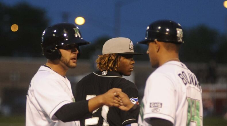 John Sansone of the Dragons (left) and manager Luis Bolivar. MARC PENDLETON / STAFF