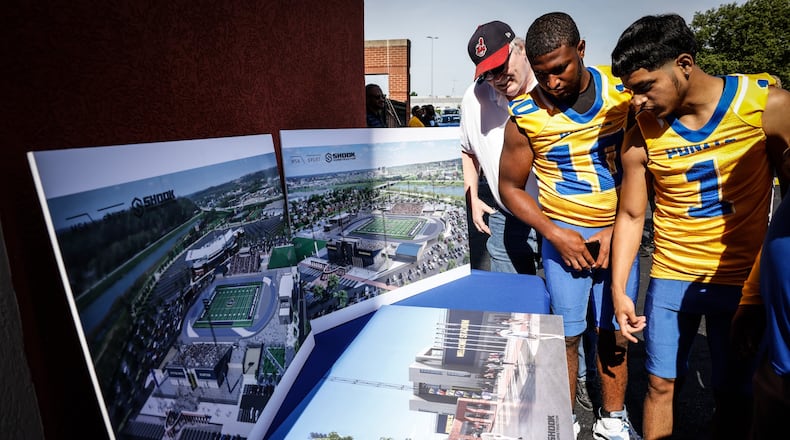Ponitz High School athletes checkout the renderings of the Welcome Stadium renovation which was kickoff Wednesday afternoon following a groundbreaking ceremony. JIM NOELKER/STAFF