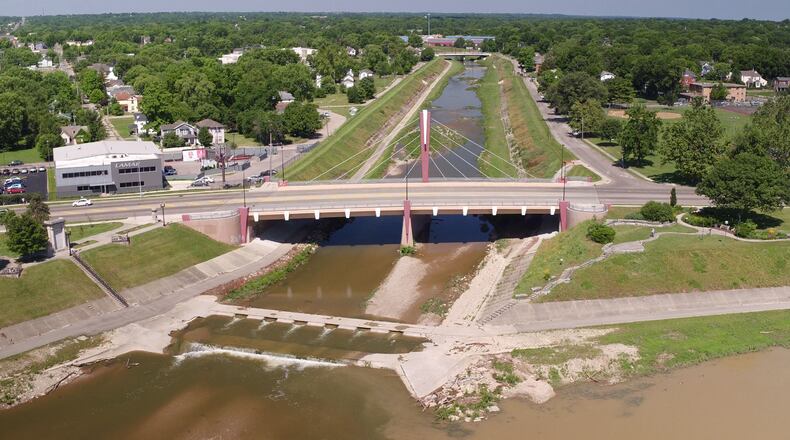 Wolf Creek looking west from the Great Miami River in Dayton. Five Rivers MetroParks has partnered with the city of Dayton and Miami Conservancy District to develop a comprehensive 20-year master plan for 12 miles of river corridor in greater downtown Dayton. The Downtown Dayton Riverfront Master Plan should be completed by summer 2018. TY GREENLEES / STAFF