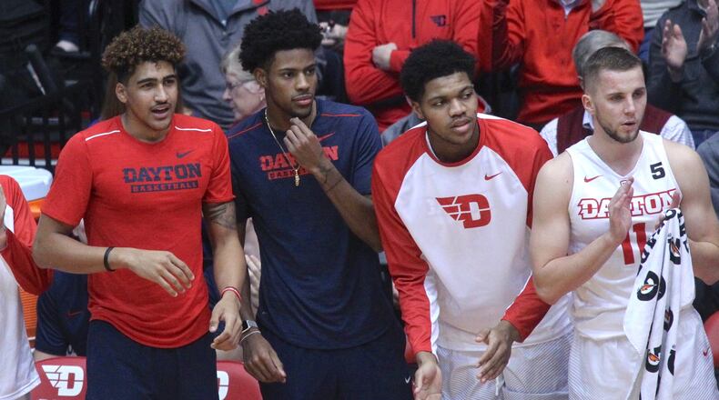 Dayton players (left to right) Obadiah Toppin, Xeyrius Williams, Jordan Pierce and Matej Svoboda cheer from the bench during a game against Tennessee Tech on Wednesday, Dec. 6, 2017, at UD Arena. David Jablonski/Staff