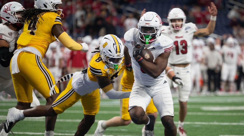 Miami (Ohio) running back Jordan Brunson (6) scores a touchdown against Western Michigan in the first half of the Mid-American Conference championship NCAA college football game on Saturday, Dec. 6, 2025, in Detroit. (Abra Richardson/Ann Arbor News via AP)