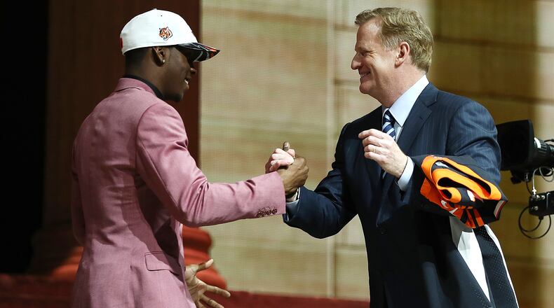 PHILADELPHIA, PA - APRIL 27: (L-R) John Ross of Washington shakes hands with Commissioner of the National Football League Roger Goodell after being picked #9 overall by the Cincinnati Bengals during the first round of the 2017 NFL Draft at the Philadelphia Museum of Art on April 27, 2017 in Philadelphia, Pennsylvania. (Photo by Elsa/Getty Images)