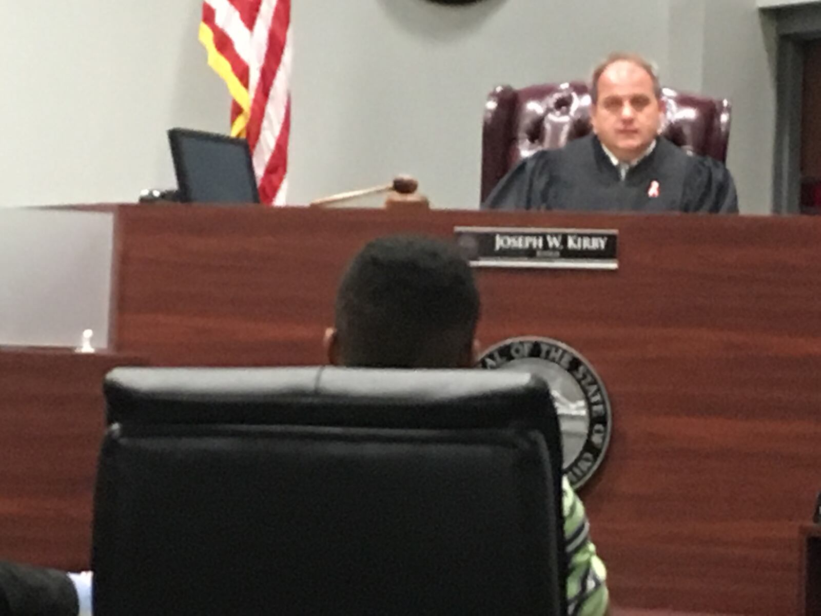 Judge Joe Kirby talks with a 15-year-old Lebanon High School student who admitted carrying a knife to lebanon High School on Sept. 15, which the teen said was to protect himself from another student.