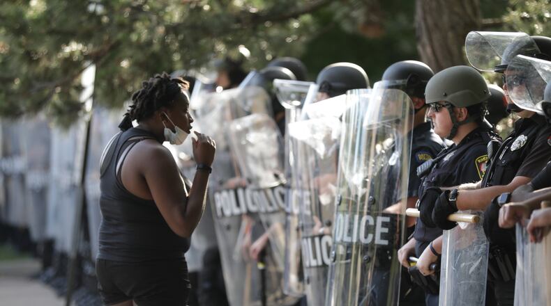 Protests continued throughout the day Saturday in response to the death of George Floyd, an unarmed black man who died in police custody in Minneapolis. STAFF PHOTO  BILL LACKEY