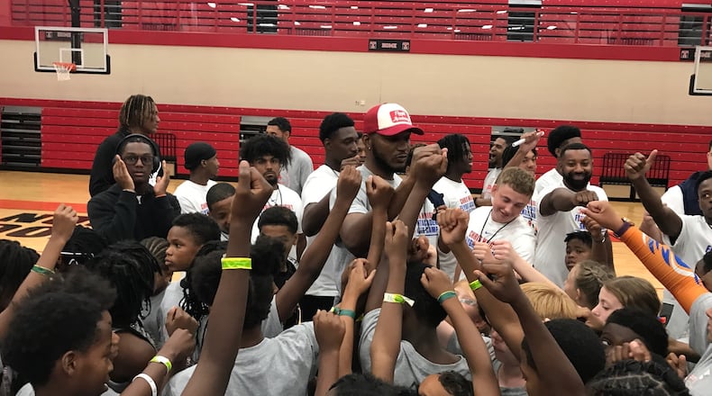 Chris Wright gathers his campers for a “1…2..3..Family!” chant to end a session. Tom Archdeacon/CONTRIBUTED