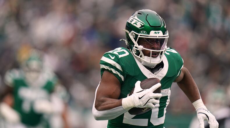 FILE - New York Jets running back Breece Hall (20) carries the ball during an NFL football game against the New England Patriots, Dec. 28, 2025, in New York. (AP Photo/Vera Nieuwenhuis, File)