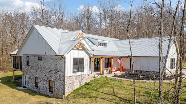 Surrounded by 11.02 acres, this farmhouse chic ranch was built in 2020 and has an open concept floor plan with a full, finished, walk-out lower level. The 6-bedroom home has about 4,575 sq. ft. of living space and a 3-car garage. CONTRIBUTED PHOTO