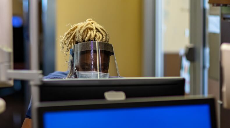 RN Destiny S. Moreland working on Covid floor entering information on computer. CONTRIBUTED BY PREMIER HEALTH