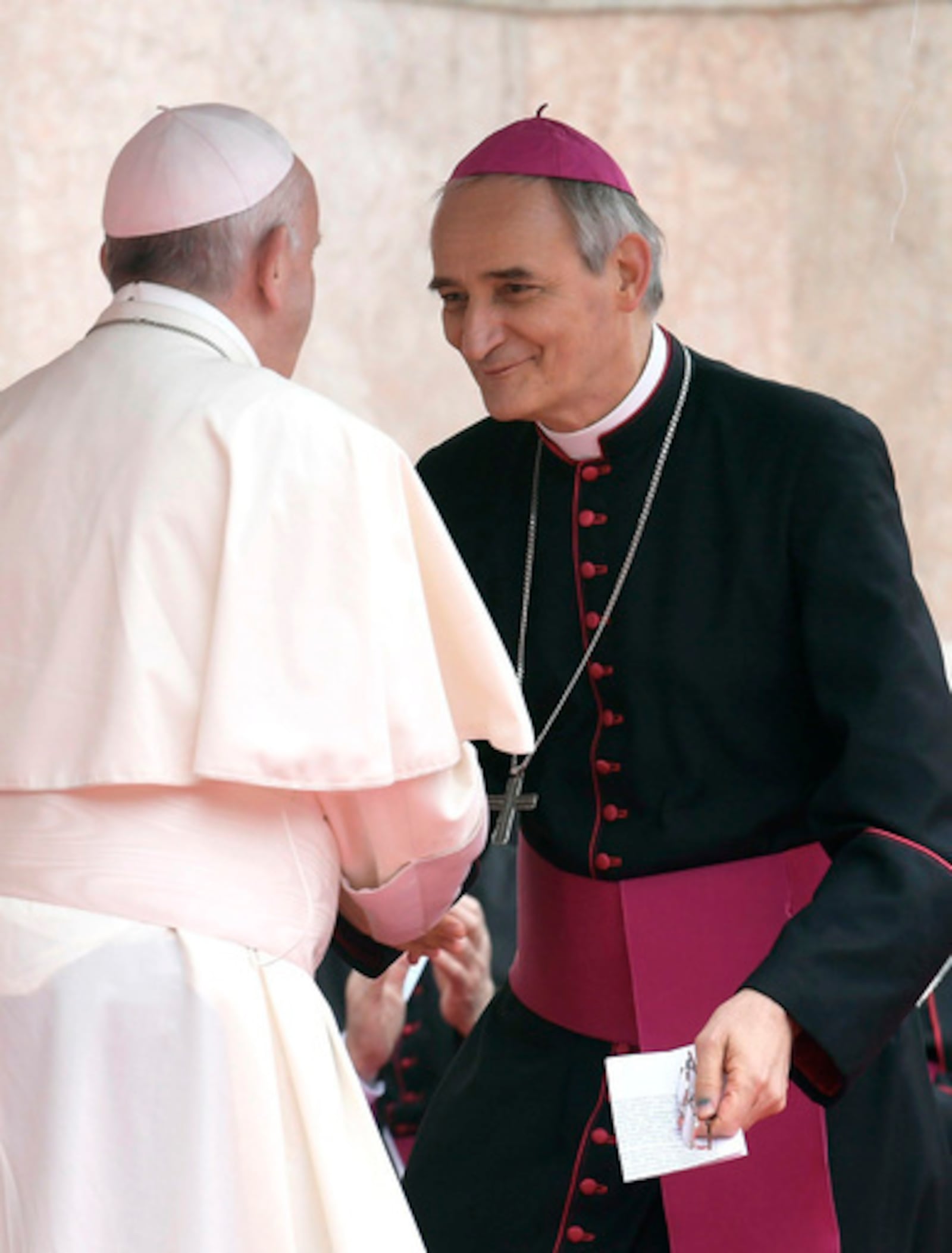 FILE - Pope Francis, left, speaks to Archbishop Matteo Maria Zuppi during his visit to Bologna, Italy, Oct. 1, 2017. (L'Osservatore Romano/Pool photo via AP, file)