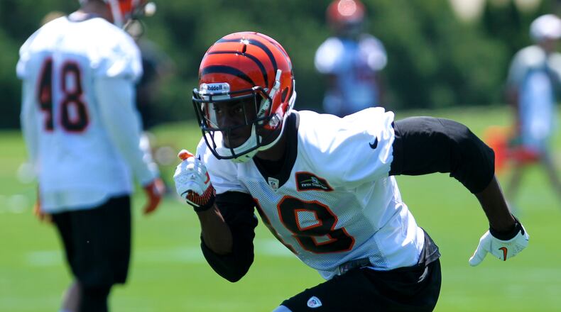 Bengals wide receiver A.J. Green (18) runs through drills during the first day of minicamp at Paul Brown Stadium, Tuesday, June 11, 2013.