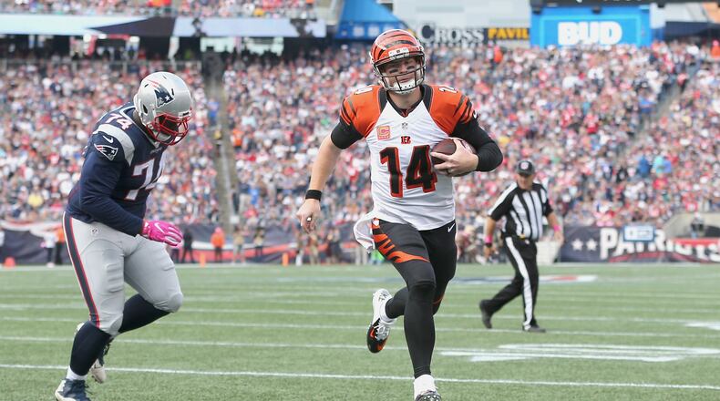 FOXBORO, MA - OCTOBER 16: Andy Dalton #14 of the Cincinnati Bengals runs in a touchdown against the New England Patriots during the game at Gillette Stadium on October 16, 2016 in Foxboro, Massachusetts. (Photo by Jim Rogash/Getty Images)