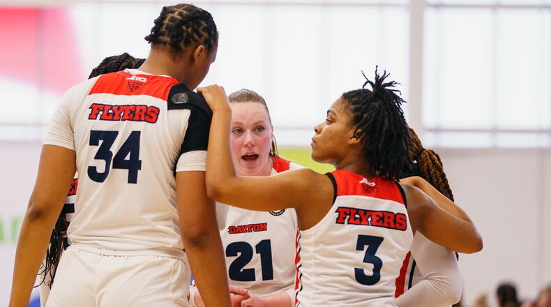 Dayton's Erin Whalen, center, tries to rally her team during the second half of an NCAA college basketball championship game against Massachusetts in the Atlantic 10 Conference tournament Sunday, March 6, 2022, in Wilmington, Del. (AP Photo/Chris Szagola)