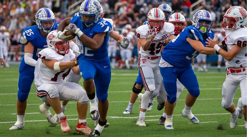Xenia's Ramon Browder breaks free for a gain against Tippecanoe on Friday night. CONTRIBUTED/Jeff Gilbert