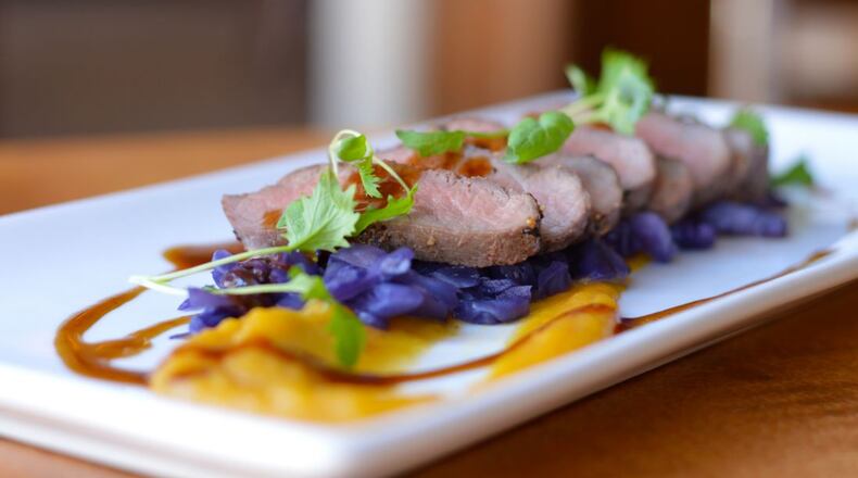 The Golden Lamb's pan-roasted lamb loin with braised red cabbage, roasted acorn squash with a port reduction was one of several entrees on the historic restaurant's Bounty of the Fall Harvest menu in 2015. The restaurant is famous for its comfort dishes and historical charm.