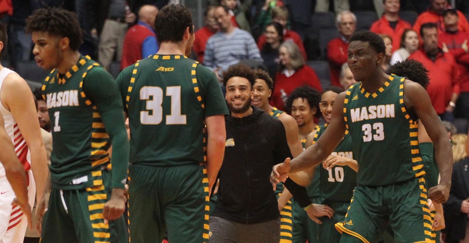 George Mason celebrates a victory against Dayton on Wednesday, Jan. 23, 2019, at UD Arena.