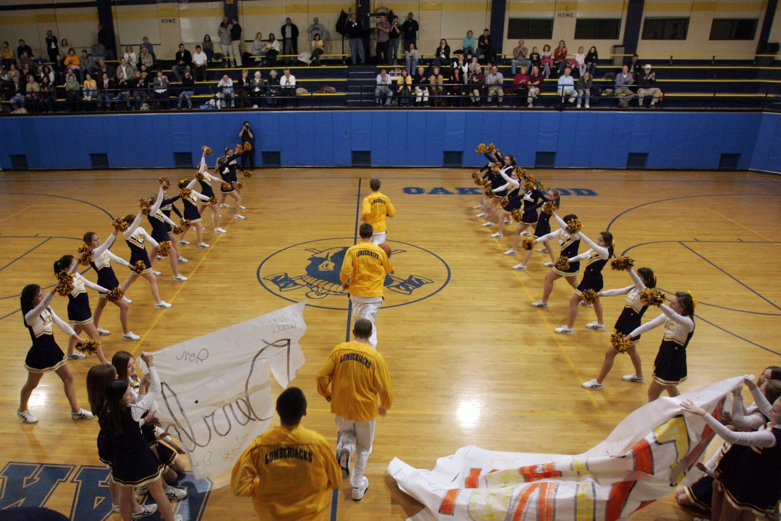 The Oakwood High School basketball team makes the grand entrance into the "Pit" as they host Brookville High School in a league game in 2007. RON ALVEY / STAFF