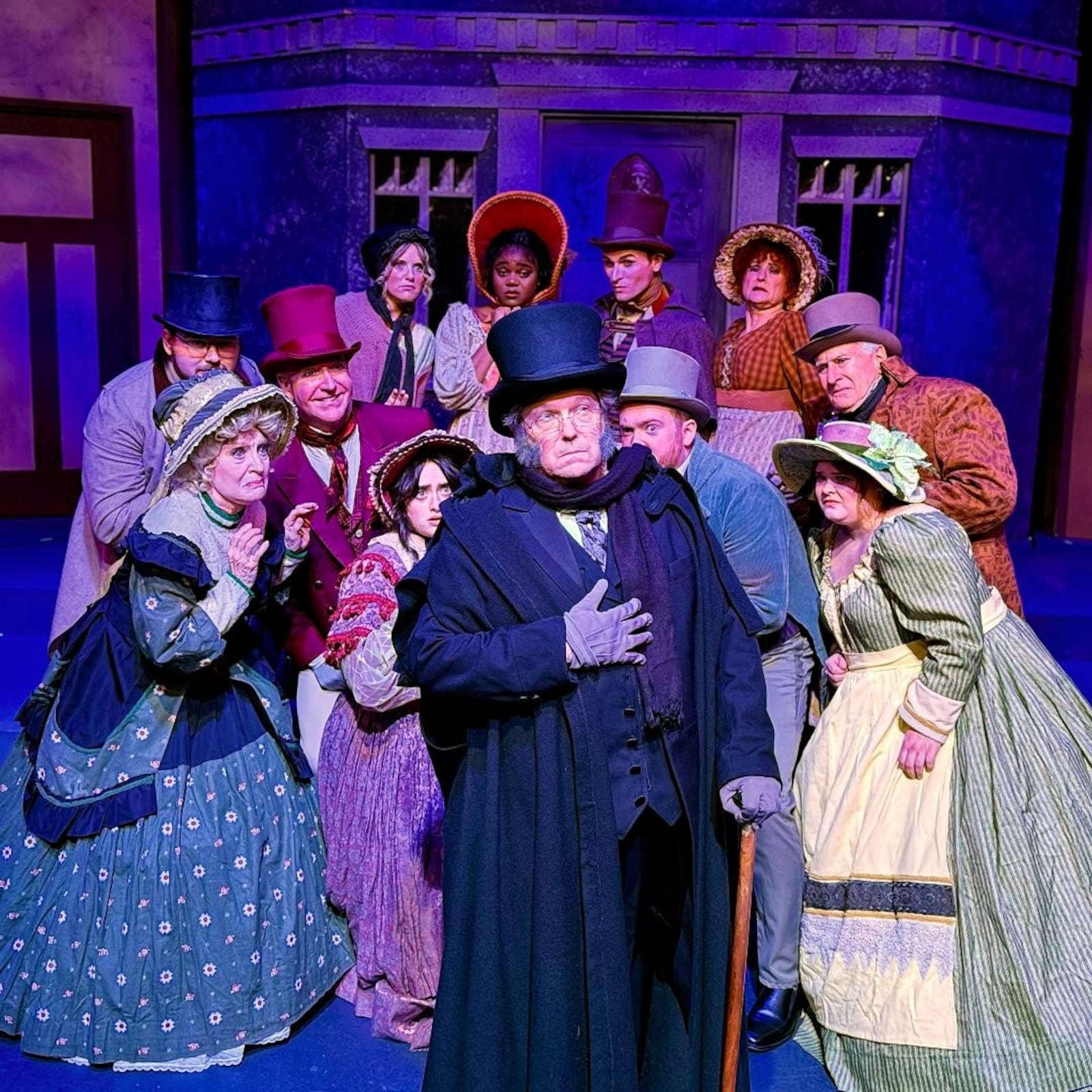 Chris Beiser (center as Ebenezer Scrooge) in La Comedia Dinner Theatre's production of "Scrooge! The Musical." Photo by Justin Walton