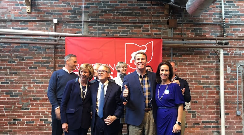 Mike DeWine, Jon Husted and other Republican candidates take part in a GOP bus tour in Columbus on Thursday. Photo by Laura Bischoff.
