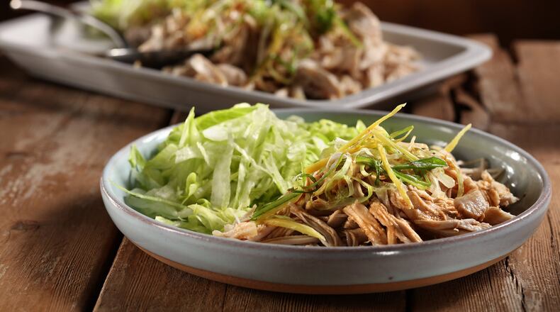 Hacked chicken is made by first poaching the meat with aromatic ingredients, then cutting up the chicken into thin strips (hacking it) and dressing it with soy, peanut oil and sherry. (Abel Uribe/Chicago Tribune/TNS)