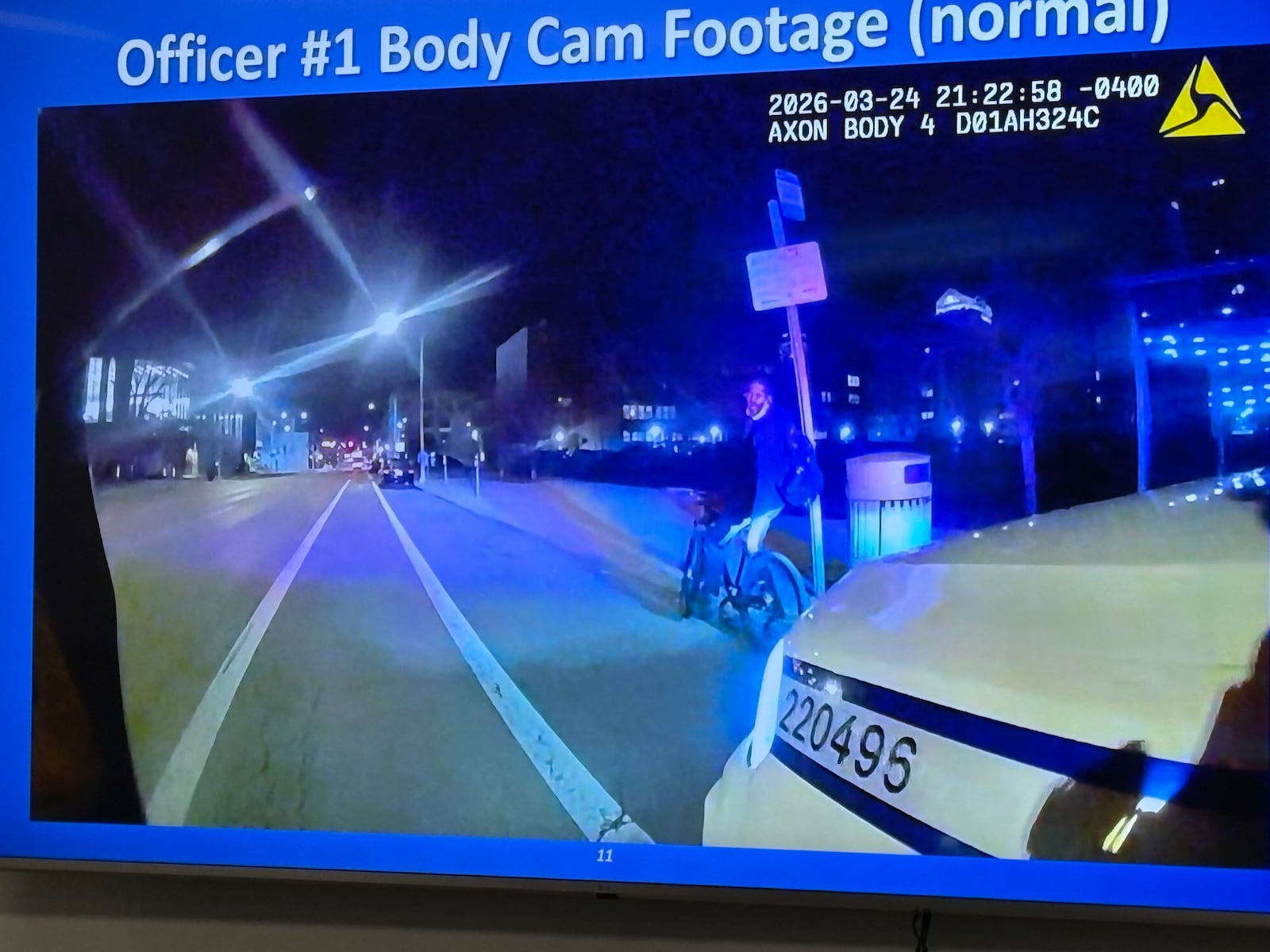 A still image from an Dayton police officer's body worn camera shows the bicyclist he stopped for a traffic violation Tuesday night, March 24, 2026. Police said the man was armed and ran away, which led to a foot pursuit and struggle that ended in the man's shooting death. JEN BALDUF/STAFF