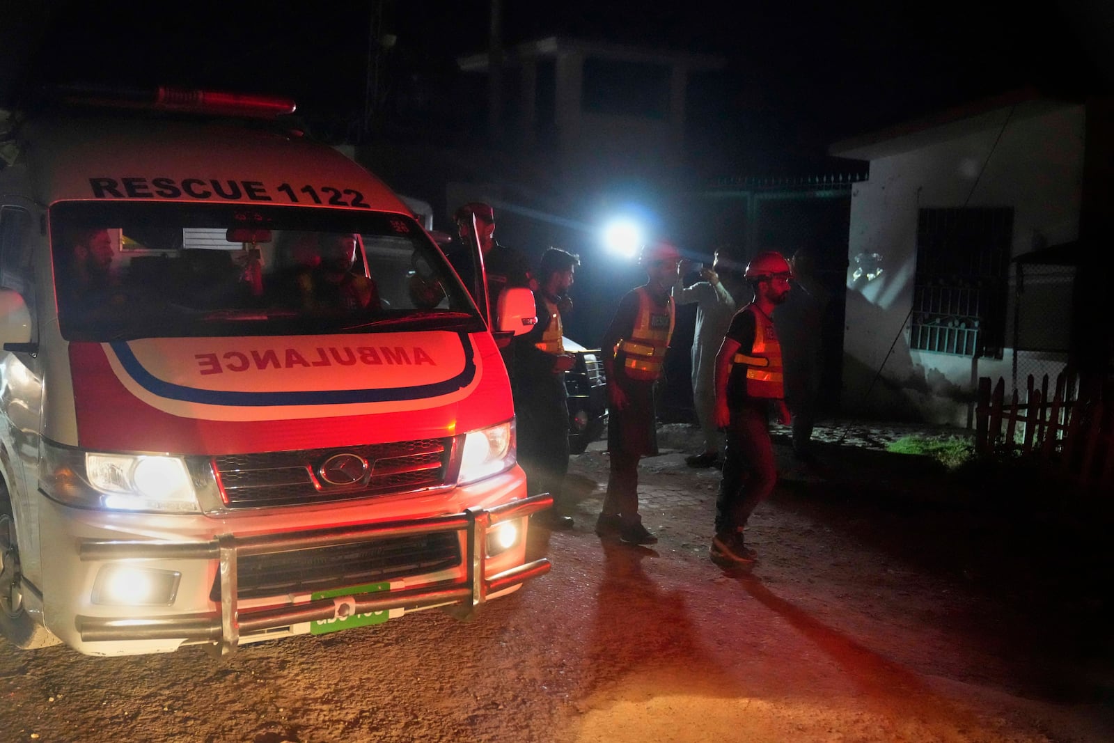 Rescue workers and an ambulance arrive at the site of a suspected Indian missile attack, in Muridke, a town in Pakistan's Punjab province, Wednesday, May 7, 2025. (AP Photo/K.M. Chaudary)