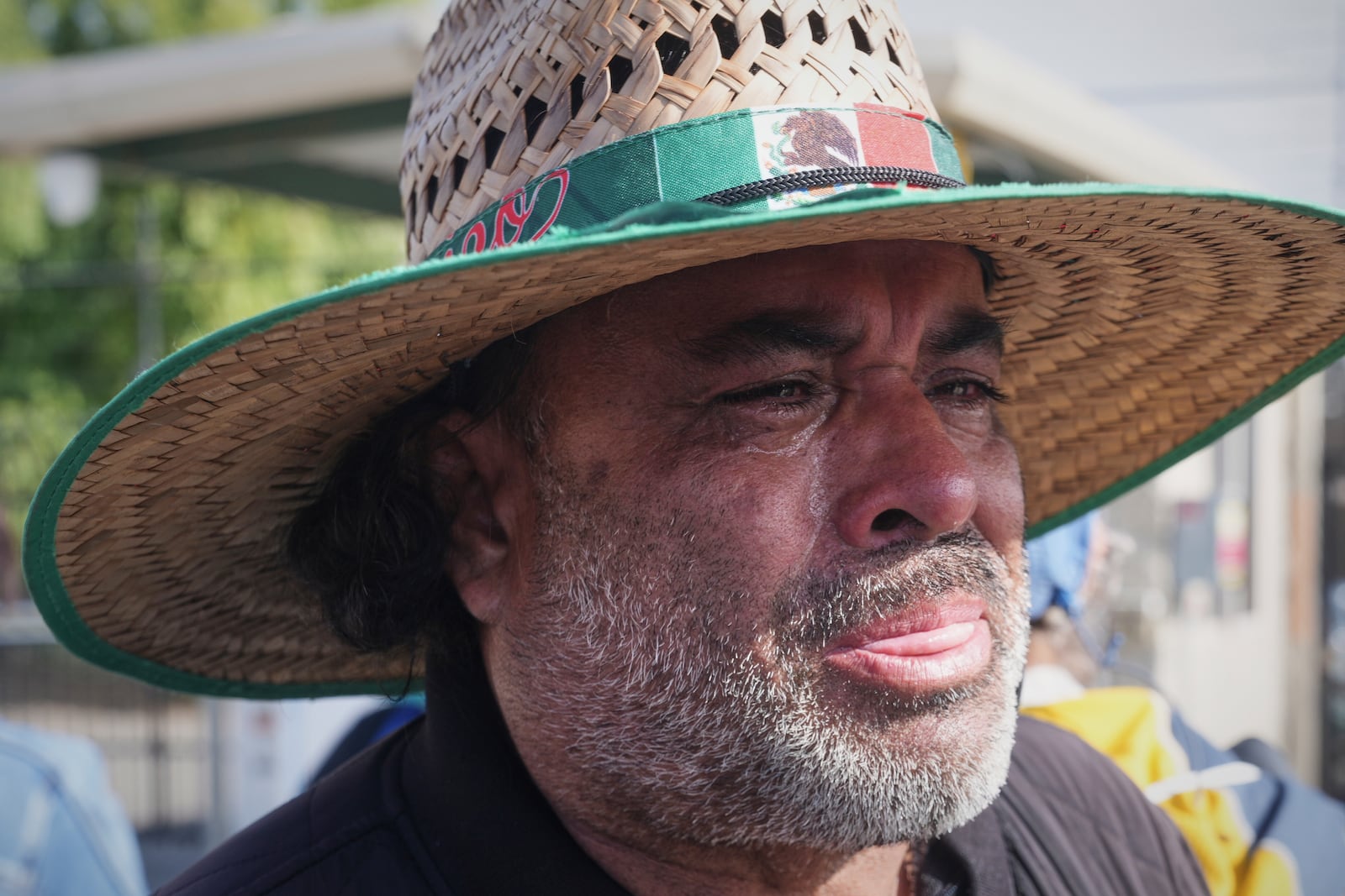 FILE - Juan Duran cries outside of Glass House Farms, where a relative was injured during a previous day immigration raid, on Friday, July 11, 2025, in Camarillo, Calif. (AP Photo/Damian Dovarganes, File)