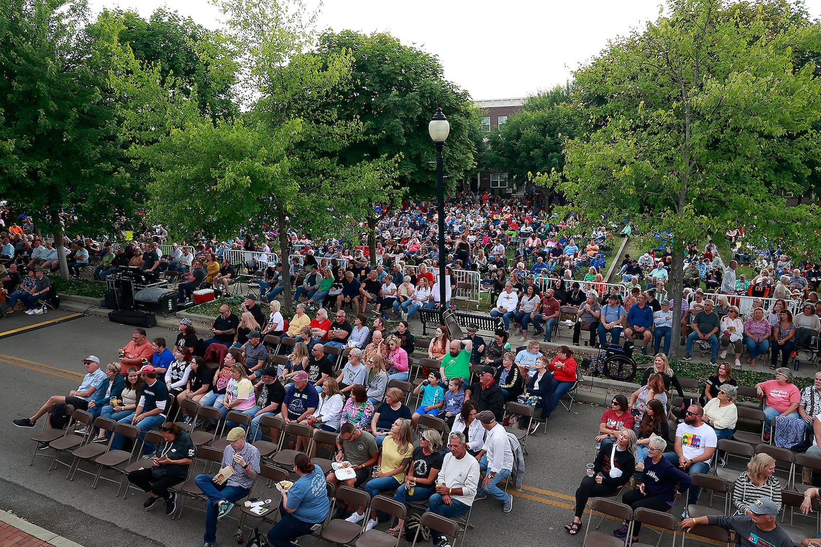 Hundreds of people gathered in National Road Commons Park in downtown Springfield for the Come Together Springfield 2023 - A Rooftop Beatles Tribute Friday, June 16, 2023. BILL LACKEY/STAFF
