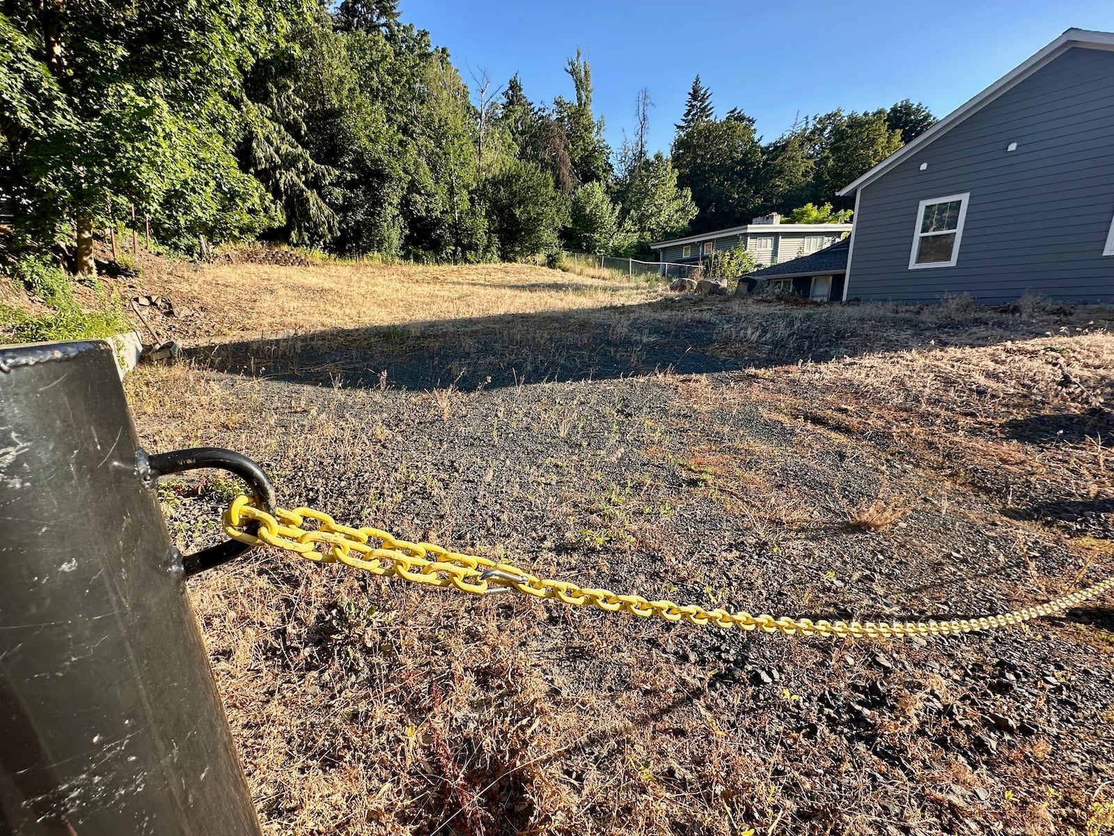 An empty lot stands on Monday, June 30, 2025, at the site where four University of Idaho students were killed in November 2022 inside a house in Moscow, Idaho. (AP Photo/Manuel Valdes)