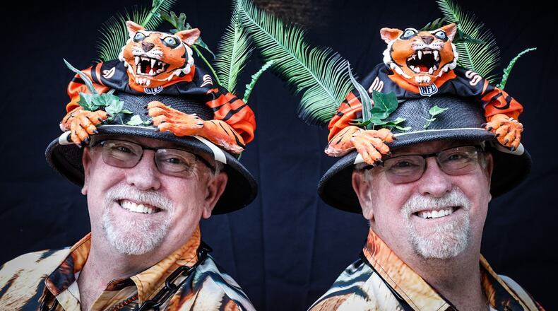 Steve and Jeff Nagel, left to right, from Riverside, are identical twins and super Bengal fans. They have held season tickets for 35 years and know many of the players personally. JIM NOELKER/STAFF