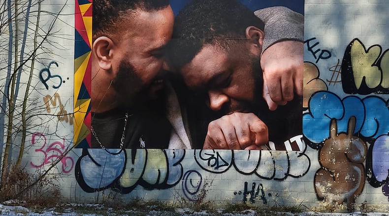 Brothers Tony and Cal Smith now have a photo of themselves embraced in a hug on a building located at Germantown Street and Dennison Avenue in Dayton. CONTRIBUTED