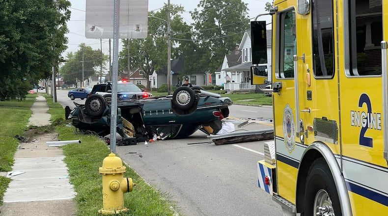 A utility pole was knocked down across the roadway during a rollover crash that caused one minor injury Friday morning, Aug. 2, 2024, on North Dixie Drive in Vandalia. CONTRIBUTED
