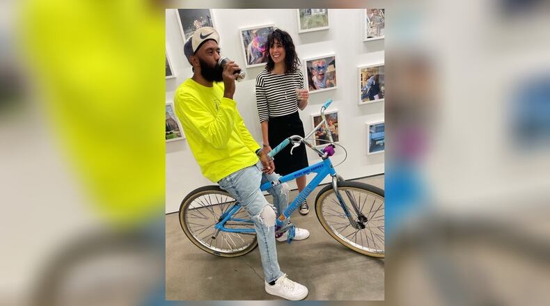 Amy Lynn Powell, right, with Boof (Brandon Smith) who is in the show and brought members of his DaytonBikeMeet group to see the exhibit. CONTRIBUTED