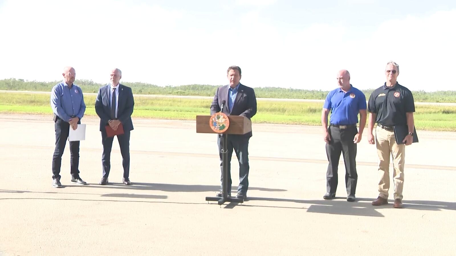 This image from a video feed shows Gov. Ron DeSantis speaking about deportation flights from the remote Everglades immigration lockup known as ”Alligator Alcatraz″ on July 25, 2025 in Ochopee, Florida. (Office Of Florida Governor Ron Desantis via AP)