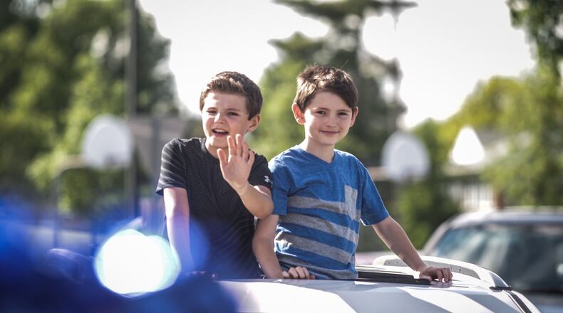 Over 100 third graders and their families drove by Brookville Elementary School Thursday afternoon. The kids teachers lined the circle drive for a clap out. Next year third graders will move to another building.
