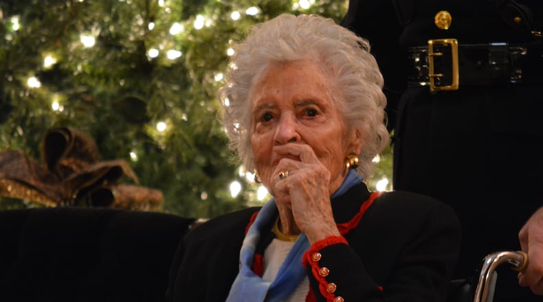 Annie Glenn visits the casket of her husband John Glenn at the Ohio Statehouse on Friday, Feb. 16, 2016. Staff