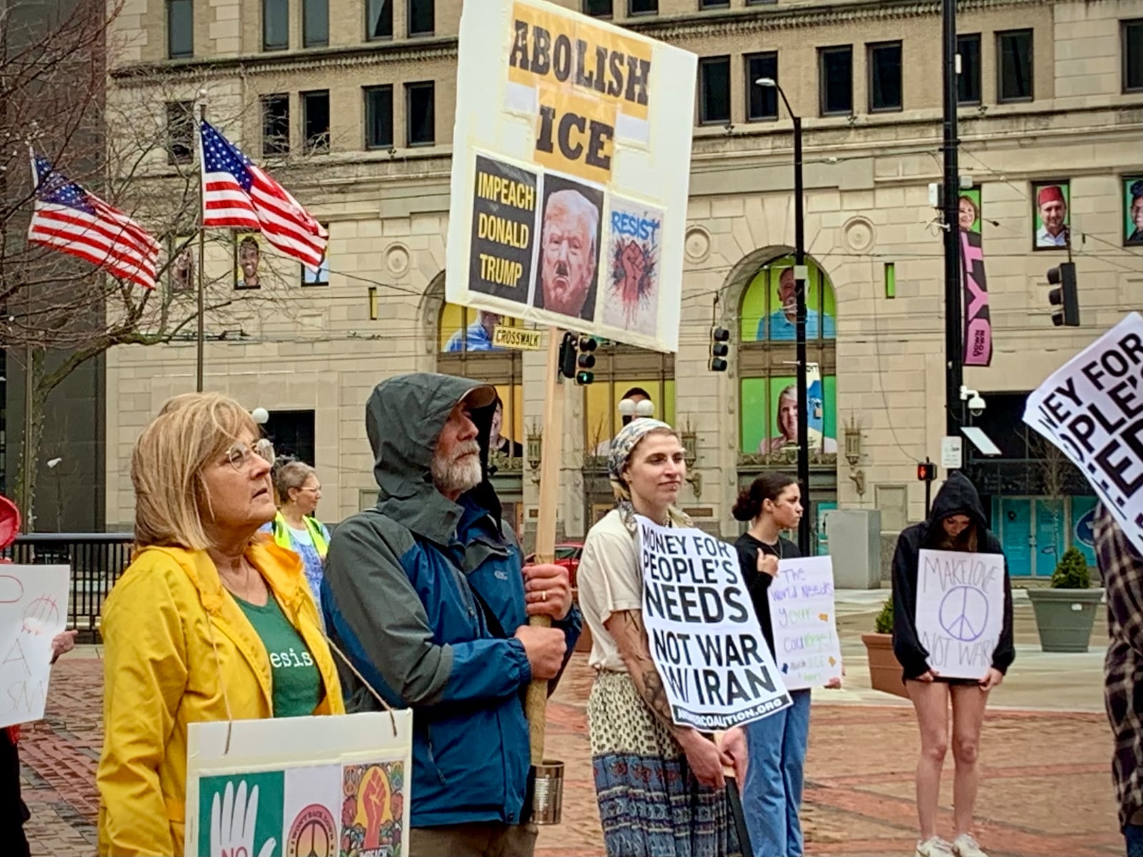 Daytonians gathered at Courthouse Square in the rain Saturday, March 7, 2026 to protest ongoing US involvement in the war with Iran. LONDON BISHOP/STAFF