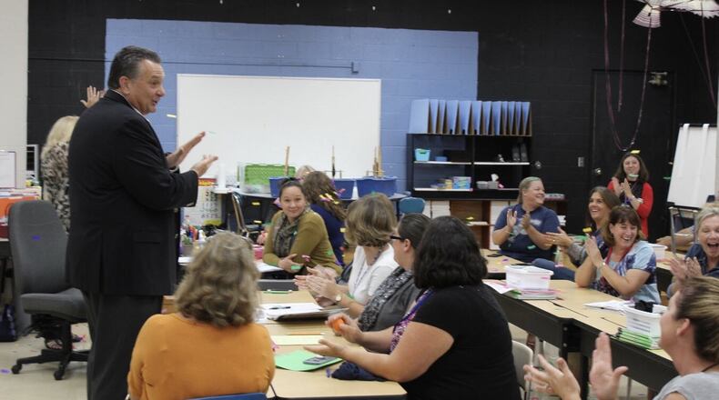 Kettering City Schools Superintendent Scott Inskeep tells teachers and staff at Indian Riffle Elementary that their school was named a National Blue Ribbon School by the U.S. Department of Education, on Monday, Oct. 1, 2018. CONTRIBUTED PHOTO