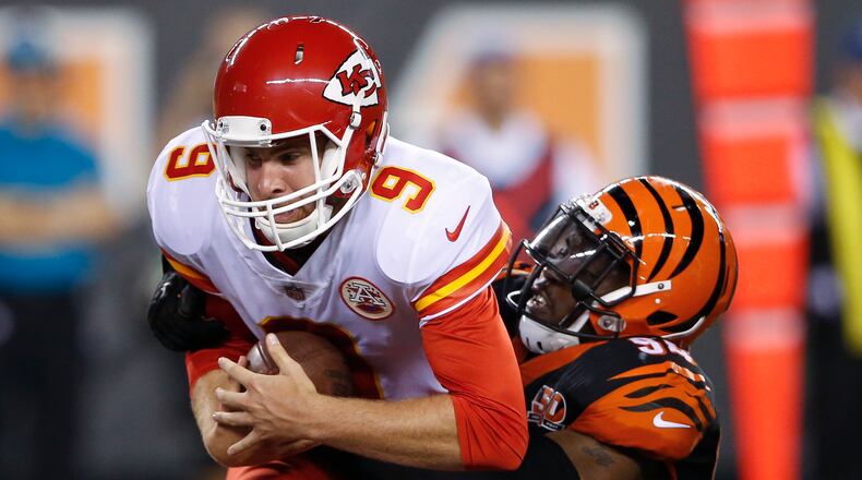 Kansas City Chiefs quarterback Tyler Bray (9) is sacked by Cincinnati Bengals defensive end Chris Smith (94) during the second half of an NFL preseason football game, Saturday, Aug. 19, 2017, in Cincinnati. (AP Photo/Gary Landers)