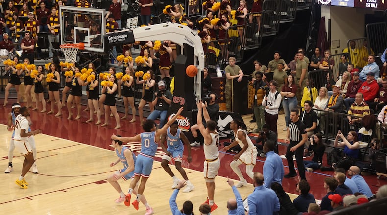Loyola Chicago's Braden Norris is fouled on a 3-point attempt in the final seconds of the first half on Friday, March 1, 2024, at Gentile Arena in Chicago. David Jablonski/Staff